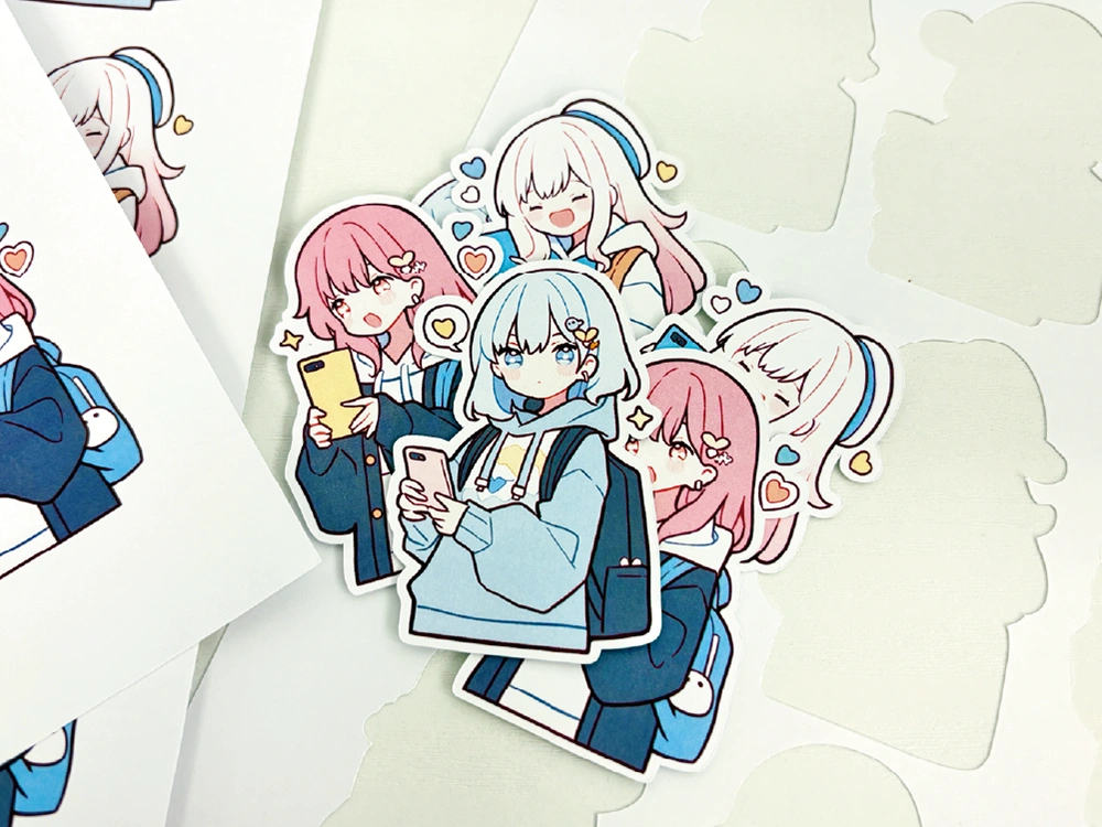 ハートや星に囲まれた、スマホを持つアニメ風キャラクターのカラフルなステッカー。